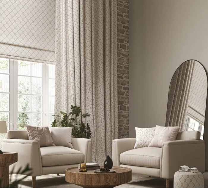 Full-length patterned curtains framing a garden room window.