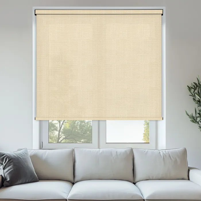 Textured natural linen blind in a softly lit living room.
